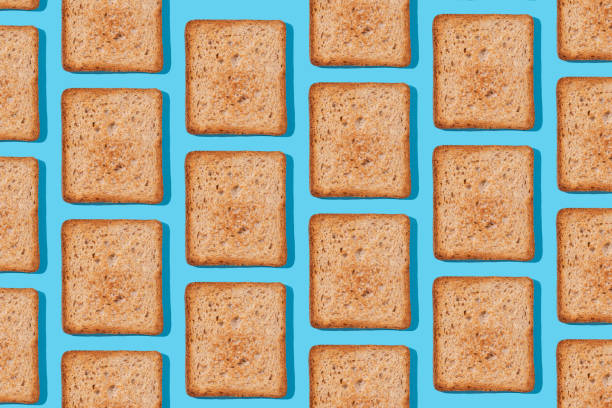 istock Toast pattern on blue background. Creative food concept, morning breakfast brunch concept. Modern minimal food photography collage 2030591729