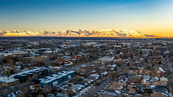 Scenic morning view of mountains range in Salt Lake city over the residential area