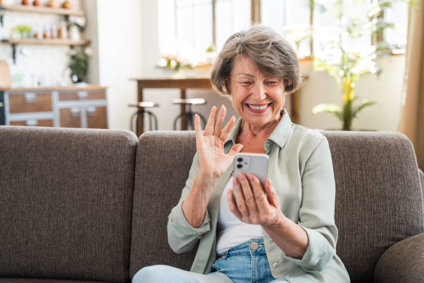 istock Happy caucasian senior grandmother using cellphone for vlogging blogging 2030600648