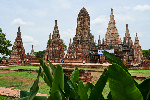 Ayutthaya, Thailand - August 26, 2023: tourists visiting the old Chaiwatthanaram temple complex.