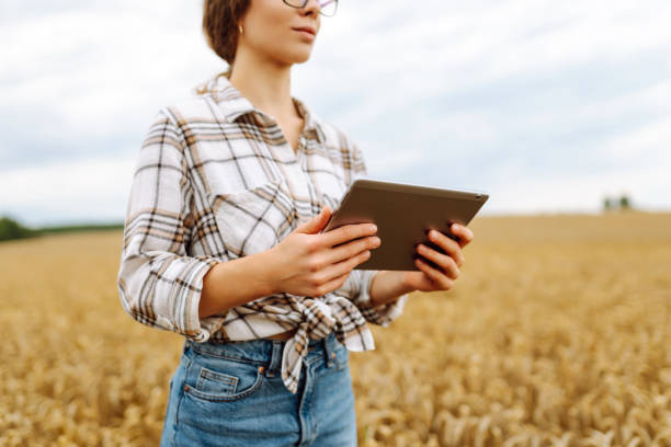 istock Young Female farmer with tablet in the field. 2030666924