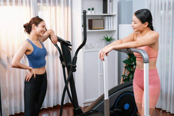 istock Energetic and strong athletic asian woman running on machine. Vigorous 2030671776