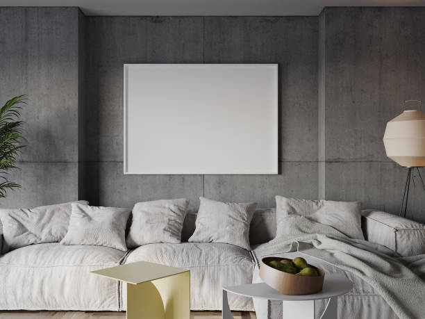 istock Mock up poster in modern living room, gray concrete wall background, white frame,. 2030683324