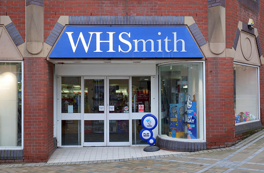 Leeds, UK 02 22 2024 The exterior of a branch of the WH Smith newsagent in the centre of the city. The sign is broken with only half of it illuminated