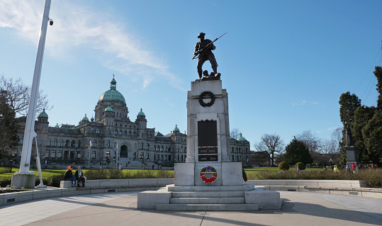 Victoria War Memorial bronze statue in front of the Legislative Assembly Parliament Building of British Columbia on Vancouver Island in Victoria, British Columbia, Canada.