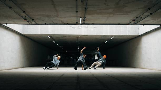 istock Long shot of hipster group dance together while perform b-boy dance. Sprightly. 2030714513