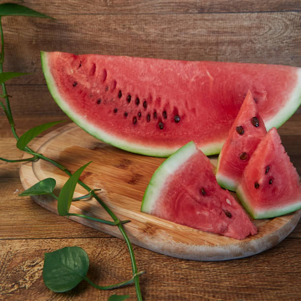 istock Cut watermelon under a wooden board
- 2030734075