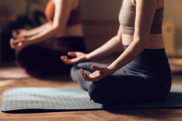 istock Close-up of Hands in Zen Gesture During Yoga Class 2030734631
