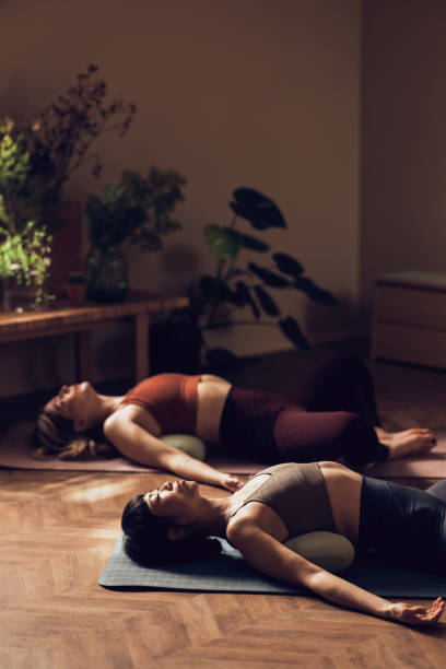 istock Two Women Practicing Yoga in a Serene Indoor Environment 2030734670