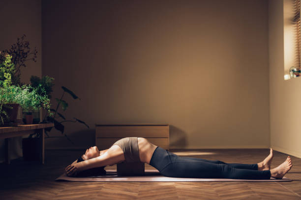 istock Young Woman Practicing Yoga in a Serene Indoor Environment 2030735767