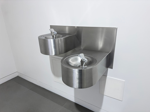 Water fountains on a wall in a public building