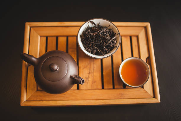 istock Wooden tableware set featuring a teapot, tea leaves bowl, and tea cup 2030829201