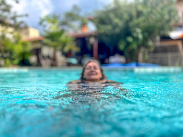 istock Senior Hispanic woman in swimming pool 2030836940