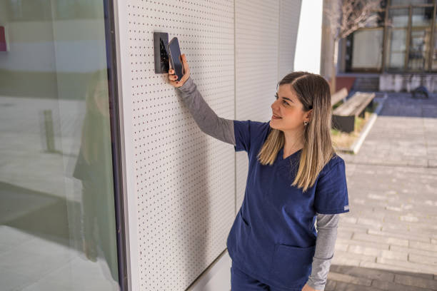 istock Nurse sends a smartphone to digitally enter the code and enter the hospital 2030853746