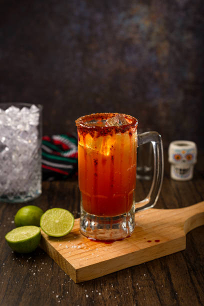 istock Michelada, typical mexican cocktail on a wooden table. Cocktail based on beer. 2030854267
