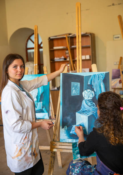 istock Fine art students painting 2030869630