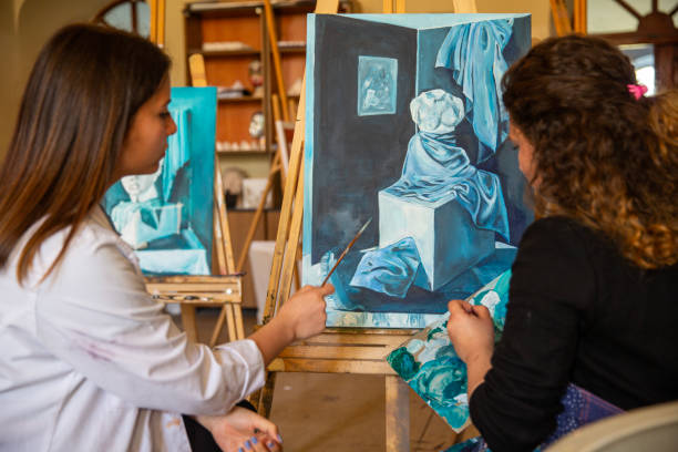 Fine art students painting