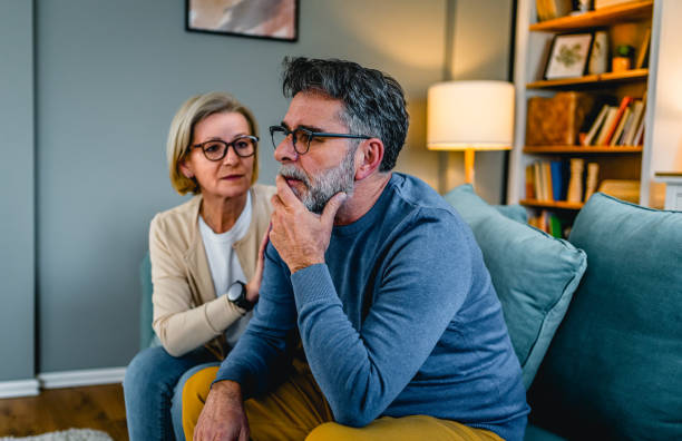 istock Woman comforting her husband 2030872276