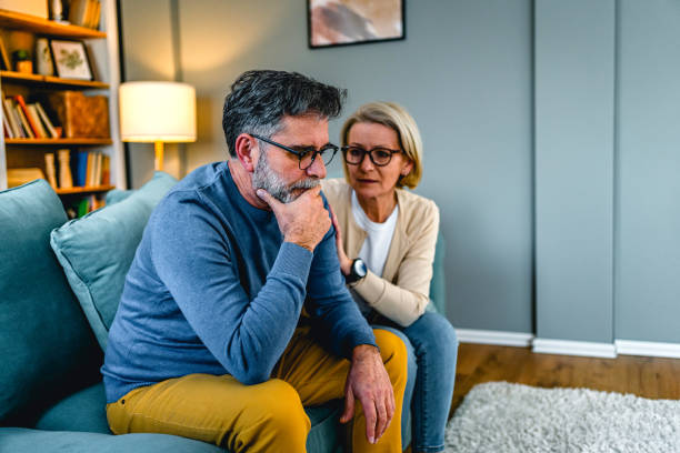 istock Woman comforting her husband 2030874926