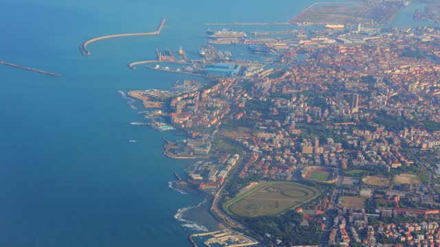 Plane flying over Livorno, Italian city