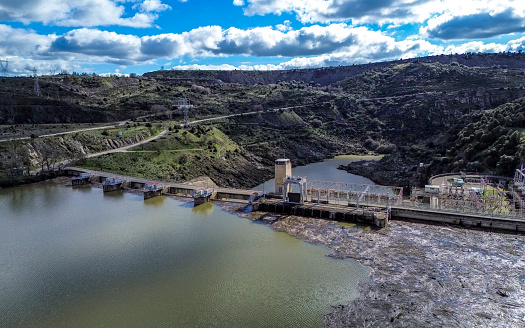 Road over the hydroelectric dam of the Villalcampo waterfall, Duero river, Castilla y León, Spain.