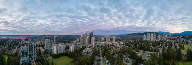 istock City skyline with towering skyscrapers, lush greenery, and open sky 2030917541