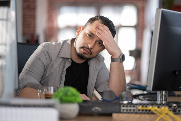 istock Emotion at work.Stressed out man working in a demanding career 2030946901