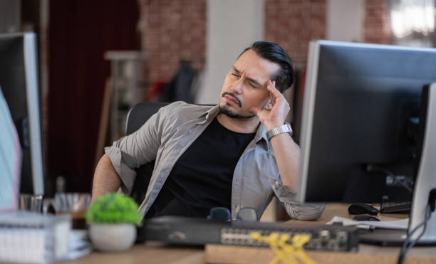 Emotion at work.Stressed out man working in a demanding career 스톡 사진