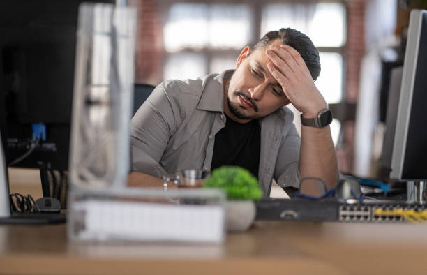 istock Emotion at work.Stressed out man working in a demanding career 2030946911