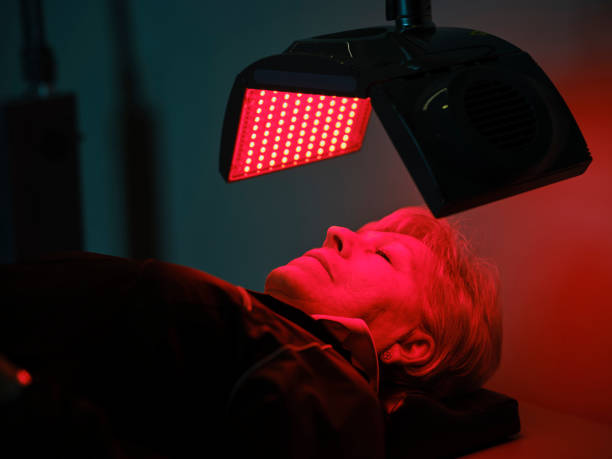 istock Woman On an LED Bed Receiving Red Light Therapy 2030966327