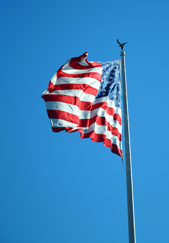 waving USA flag on pole