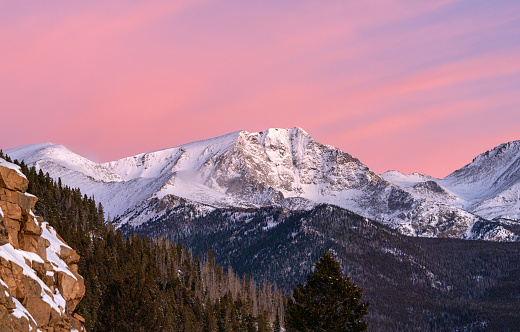 Beautiful vibrant sunrise over the extreme winter terrain of Rocky Mountain National Park near Estes Park, Colorado USA.