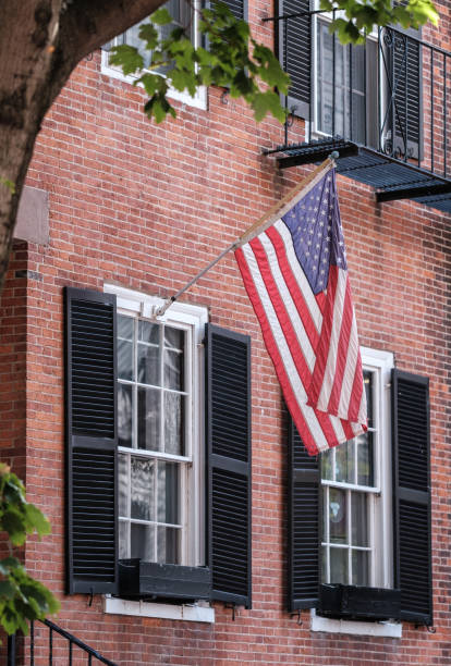 istock Boston Beacon HIll Townhouse WIth USA Flag 2031045832
