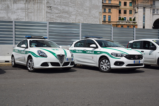 Milan, Italy - 28th May, 2018: Police cars Alfa Romeo Giulietta and Fiat Tipo stopped on a street. These models are popular police vehicles in Italy.