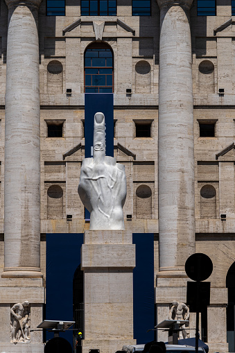 The middle finger, Piazza Affari, Milan-Italy. Sculpture in piazza Affari symbol of freedom. The sculpture is one of the modern of the city of Milan in the Italian Lombardy.