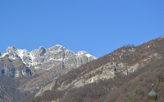 Panoramic view of snow-capped Mount Resegone in winter.