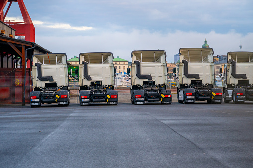 Gothenburg, Sweden - november 12 2023: Row of five white DAF trucks at a parking lot.