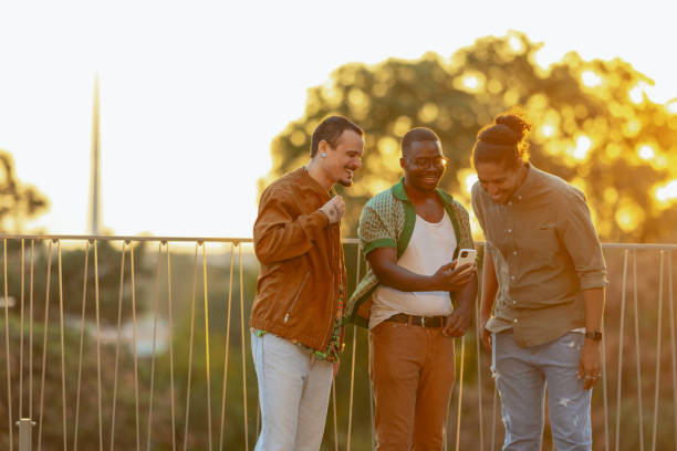 istock Group of male friends talking and using smart phone 2031190345
