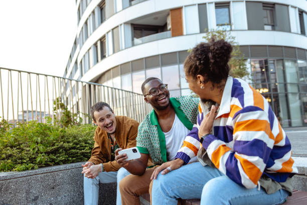 istock Group of male friends talking and using smart phone 2031193530