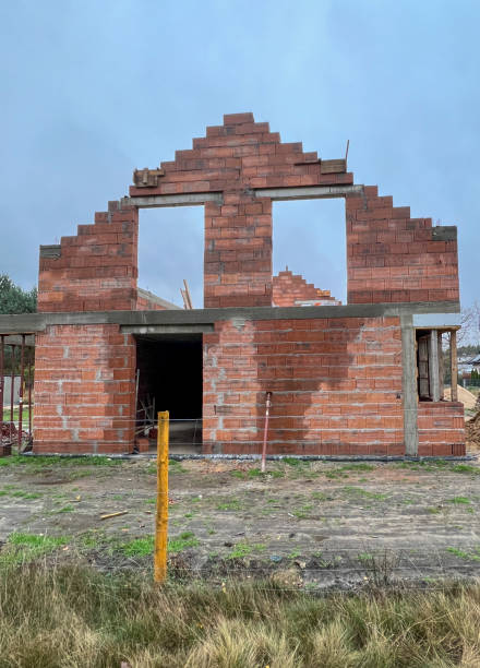 istock Construction of a house using slotted brick technology in autumn and winter conditions 2031236343