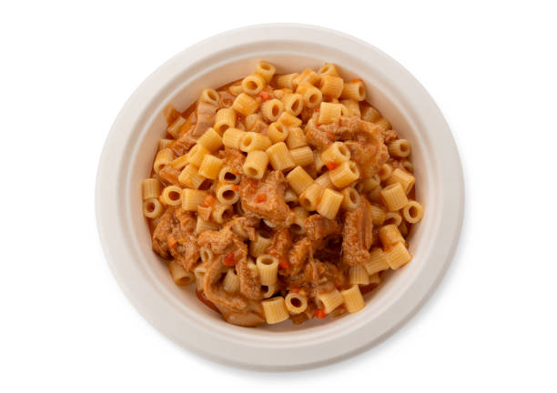 Ditalini pasta with tomato sauce tripe in white plate isolated on white with clipping path included in top view