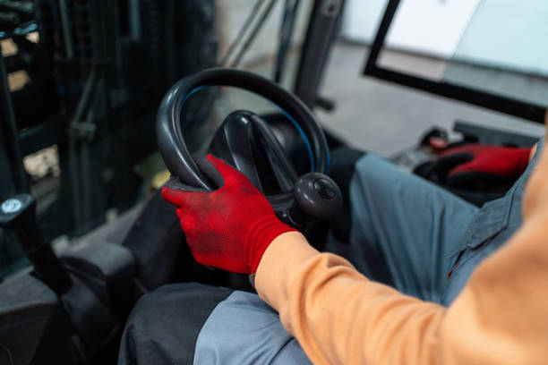 istock Close up shot of an unrecognisable worker driving forklift 2031270474