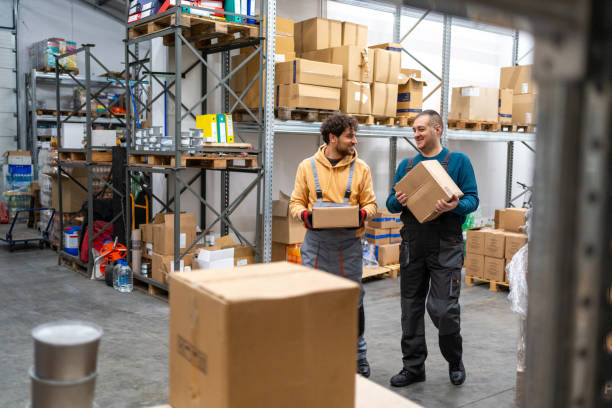 istock Two colleagues working at distribution warehouse center 2031272025