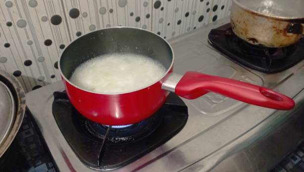 istock Red pot on the stove, kitchen utensil for cooking 2031303679