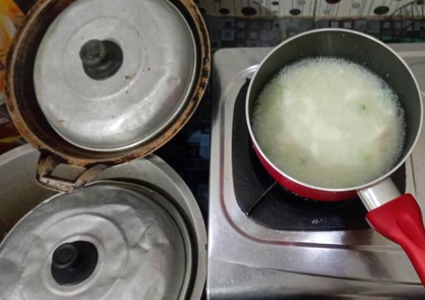 istock Red pot on the stove, kitchen utensil for cooking 2031303687