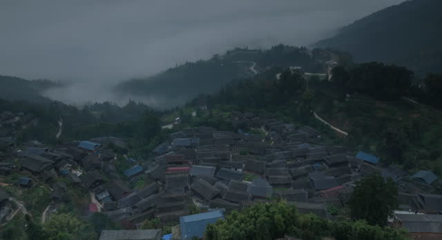 A large Miao village is above the clouds and mist