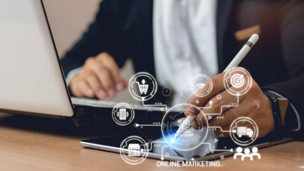 istock businessman hand working with laptop computer, tablet and smart phone in modern office with virtual icon diagram at modernoffice, Digital Marketing, laptop using ,Social, media, Marketing concept. 2031326594