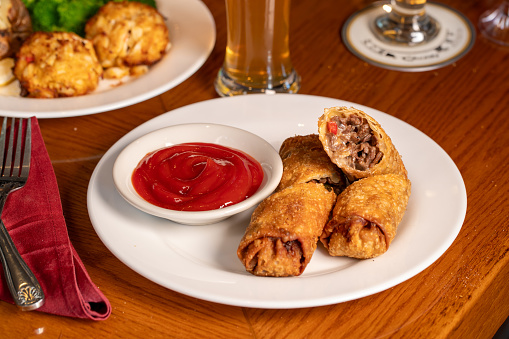 Cheesesteak Egg Rolls with ketchup
