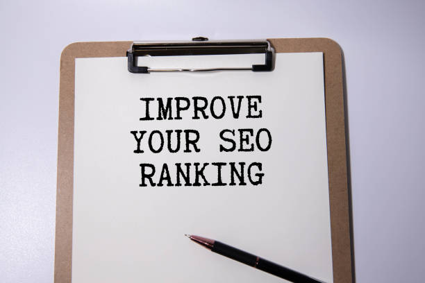 istock Paper plate with text Improve Your Seo Ranking. Diagram, notepad and blue background. 2031372862