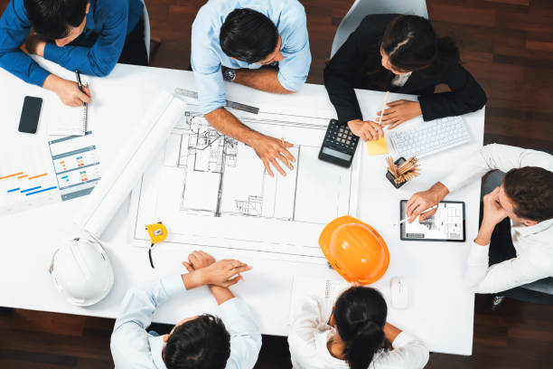 istock Diverse group of civil engineer and client working on architect. Prudent 2031404269